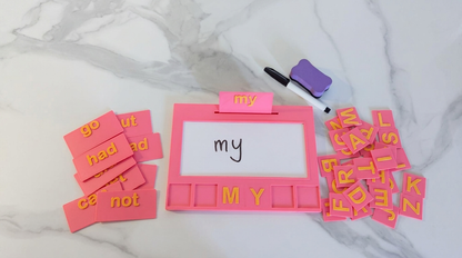 Pink Entirely Kids Sight Word Board with sight word cards, alphabet letter tiles, whiteboard marker and eraser